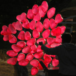 red heart shaped helium balloons